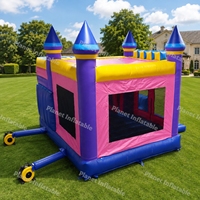 Château gonflable commercial avec toboggan pour enfants, idéal pour les fêtes en plein air et la location commerciale