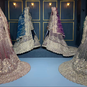 Lehenga en velours de luxe avec une traîne longue et lourde, ornée de pierres et de broderies à la main, disponible dans quatre couleurs riches - Product Image 1