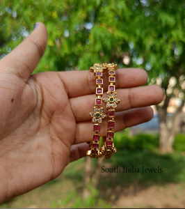 Gold-<b>toned</b> bangles with textured patterns and <b>red</b>/green enamelwork. Traditional Indian jewelry. Available at wholesale prices. - Product Image 2