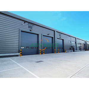 <span class=keywords><strong>Porte</strong></span> sectionnelle en acier galvanisé ignifuge avec petite <span class=keywords><strong>porte</strong></span> pour usine de fabrication stockage d'atelier <span class=keywords><strong>porte</strong></span> industrielle durable - Product Image 2