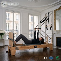 Lit de Pilates professionnel en chêne massif réglable 2-en-1 avec kit demi-tourneuse pour studio de yoga