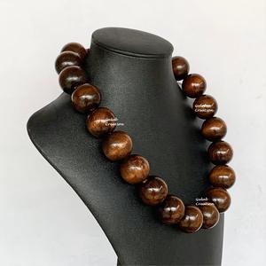 Bold Round Brown Wooden <b>Beaded</b> <b>Necklace</b> for Women <b>Chunky</b> Natural Wood Statement Jewelry for Boho, Tribal, and Ethnic Fashion - Product Image 3