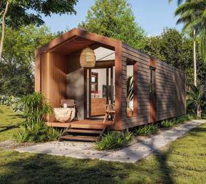 Maisonnette modulaire moderne avec un extérieur en lattes de bois, un porche avant couvert et un toit en pente. - Product Image 1