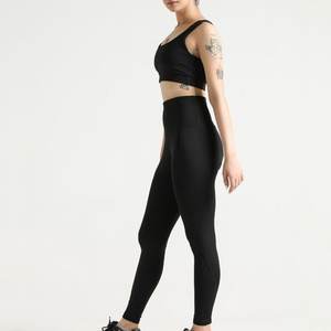 Ensemble de yoga deux pièces taille mi-haute pour femme, avec logo personnalisé, vêtements de sport écologiques, soutien-gorge respirant, leggings à taille élastique, motif uni - Product Image 2