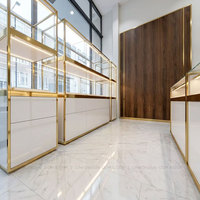 Vitrine de présentation de bijoux de luxe blanche et dorée, vitrine moderne haut de gamme pour montres, meuble pour l'aménagement intérieur d'une bijouterie