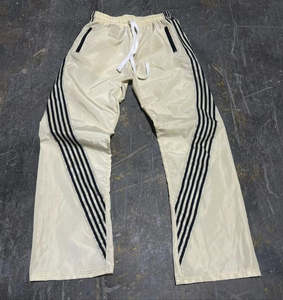 กางเกงแทร็คสตรีทแวร์ลายทางผ้าโพลีเอสเตอร์ปักโลโก้ทรงโอเวอร์ไซส์ขากว้างสไตล์แบ็กกี้สำหรับผู้ชาย - Product Image 1