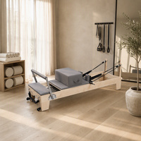 Lit de Pilates Reformer avec cadre en érable d'Amérique du Nord massif, ressorts allemands et poulies réglables pour studio et usage domestique