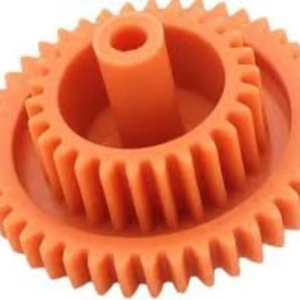 Premium quality an orange plastic gear which is a type of mechanical component used to transmit rotary motion - Product Image 1