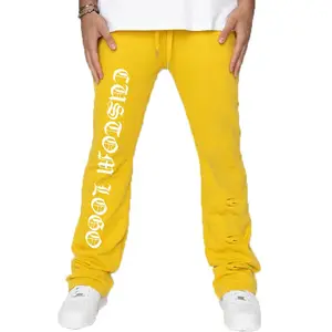 Pantalon évasé le plus récent avec broderie de conception de coeur pantalon évasé de lavage acide de couleur jaune avec la conception de fond de cloche