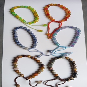 Pulseras de ágata hechas a medida hechas de ojo de tigre, Cuarzo Rosa y cuentas de cornalina - Product Image 1