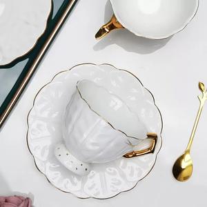 European High Quality Embossed Leaf Pattern Bone <b>China</b> Coffee <b>Cup</b> and Saucer Set featuring gold rim and handle - Product Image 3