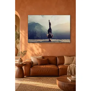 Fida, femme en position de tête en bas, devant des montagnes brumeuses, impression sur toile - Product Image 1