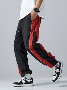 Pantalon de survêtement élégant pour homme, coupe ample et large, avec empiècements contrastants noir et blanc, taille à cordon de serrage, confortable pour le quotidien - Product Image 2