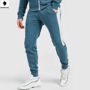 Baggy coupe-vent personnalisé 2 pièces pour femme Survêtement uni en nylon décontracté taille élastique devant plat motif en laine Service OEM - Product Image 5