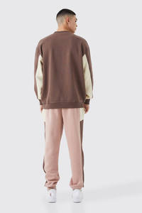 ชุดเซ็ตแทรคสูทโอเวอร์ไซส์แบบยูนิเซ็กซ์ สีบล็อกตัดต่อ พร้อมเสื้อสเวตเชิ้ตและกางเกงจ็อกเกอร์ สกรีนโลโก้ได้ตามต้องการ แฟชั่นสตรีทแวร์ ผลิตโดย Marfa International - Product Image 2