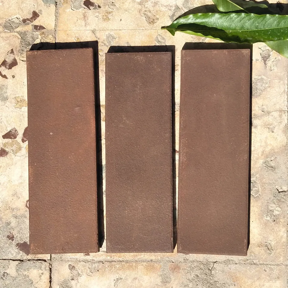 Brown clay terracotta wall cladding and clay floor tiles for garden indoor outdoor floor and wall brick covering cladding