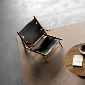 Sillín de cuero negro de diseño rústico danés, sillón de salón de madera de baja inclinación