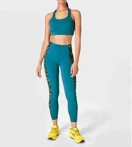 Pantalones deportivos de cintura alta brillantes personalizados para mujer, recién llegados, mallas de Yoga, bolsillos prácticos, ropa deportiva con estampado de patrón sólido - Product Image 1