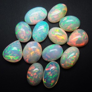 Cabujones de ópalo etíope de fuego de forma ovalada calibrada de calidad extrafina, Ópalo etíope Natural, venta al por mayor, lote de piedras preciosas naturales OEM - Product Image 1