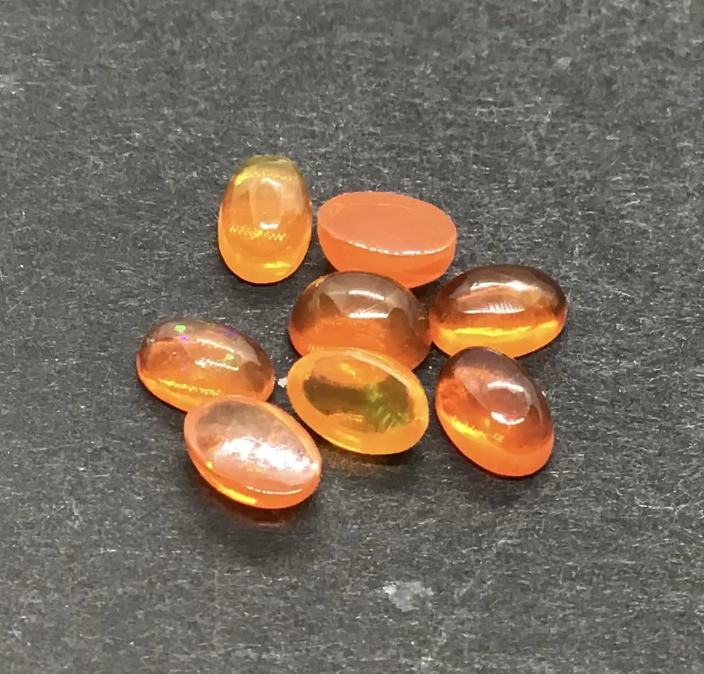 برتقال إثيوبي طبيعي 3x5 أوبال بيضاوي الظهر مسطح من الخلف ، لعب متعدد النار أوبال لجميع أنواع صنع المجوهرات