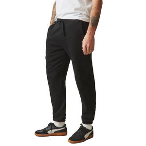 Pantalones de chándal de tela de poliéster transpirable con bolsillos laterales y piernas cónicas ideales para hacer recados o relajarse en casa - Product Image 1
