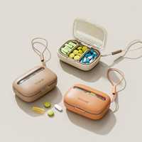 Organisateur de pilules compact personnalisable en gros avec compartiments, étui à médicaments portable à fermeture sécurisée pour la maison, les voyages et l'usage quotidien