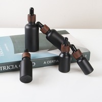 Vente en gros de flacons compte-gouttes en verre givré noir mat de 15 ml, 20 ml, 30 ml, 50 ml, 100 ml, 200 ml pour huiles essentielles et soins de la peau