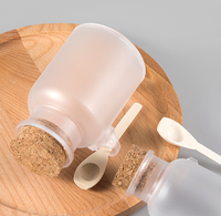 Bocaux en plastique givré pour sels de bain avec bouchons en liège et cuillères en bois, bouteilles rechargeables pour poudre de masque 100g 200g 300g 500g