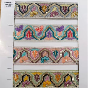 Tela de encaje bordado floral colorida vibrante y detallada con patrones intrincados, perfecta para la moda de alta gama - Product Image 1