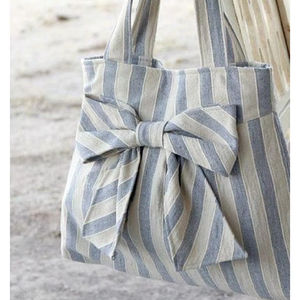 Blue Striped Bow Tote <b>Bag</b> With Classic Bow Detail <b>On</b> Cotton Fabric In Blue And White Designed For Simple Everyday Shoulder <b>Carry</b> - Product Image 1