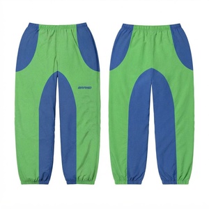 Pantalon coupe-vent réversible en taffetas 100 % coton de qualité supérieure, style streetwear, avec empiècements color block vert et bleu, fermeture à cordon, léger - Product Image 1