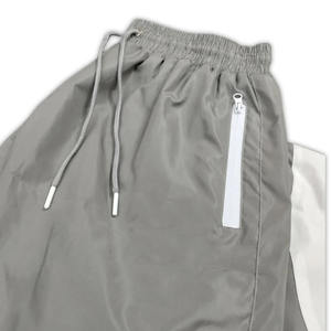 Pantalon coupe-vent personnalisé en polyester superposé Survêtement en nylon pour hommes Ensemble de survêtement deux pièces avec fermeture éclair Vestes coupe-vent pour hommes - Product Image 6