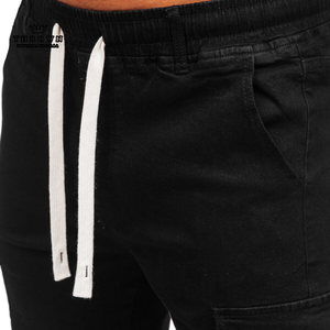 2024 nuevos pantalones cortos de algodón de moda de verano para hombres transpirables antiarrugas de gran tamaño liso teñido patrón sólido negro 100% lona OEM/ODM - Product Image 1
