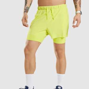 Short de course d'été de style High Street pour hommes Short de sport à séchage rapide avec logo personnalisé et poches à motif solide - Product Image 1