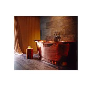 Deep soaking antique copper bath tub with rustic finished adnd handcrafted detail for serene bath environments - Product Image 1