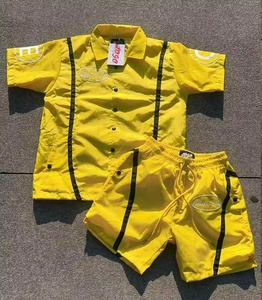 Unisex Otoño 2 piezas sólido a prueba de viento Jogging SweatSuit logotipo personalizado Nylon chándal transpirable rompevientos Polos pantalones cortos - Product Image 1