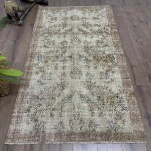 Turkish Vintage Rug 3.7x6.6 ft (113x200 cm), <b>Brown</b> Floral <b>Wool</b> Rug - Product Image 1