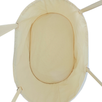 Lit bébé en coton biologique, tissu respirant à couches d'air, design ovale, sangles réglables, matelas en fibre de coco, fabricant OEM