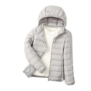 Nueva venta al por mayor cremallera Puffer mujer chaqueta transpirable a prueba de viento con capucha Puffer chaqueta tendencia OEM chaqueta de invierno fabricante - Product Image 1