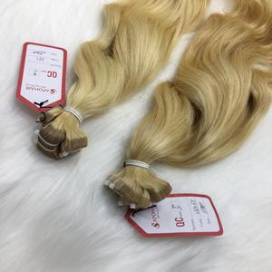 Extensiones de cabello de materia prima humana ondulada natural HD cinta normal cabello vietnamita rubio claro de alta calidad al por mayor - Product Image 2