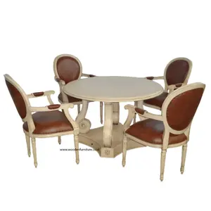 Conjunto de sala de jantar estilo francês, contém mesa de jantar redonda com gavetas e cadeira de jantar com braços para quatro pessoas