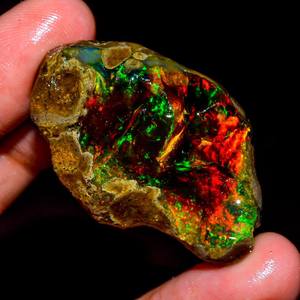 Amazing Multi Fire Natural Ethiopian Opal Play Of Fire Color Oil Rough Loose Gemstone For Making Women Silver Jewelry Wholesaler - Product Image 1