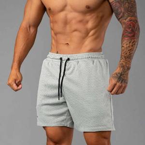 Vêtements de sport de basket-ball 100% coton personnalisés pour hommes, short en maille de style décontracté à motif unique pour l'entraînement et la course - Product Image 1
