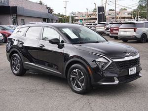 Incroyable Kia Sportage hybride LX AWD 2023 noir avec roues en alliage Sièges en cuir Système de navigation Démarrage à distance Toit ouvrant - Product Image 2