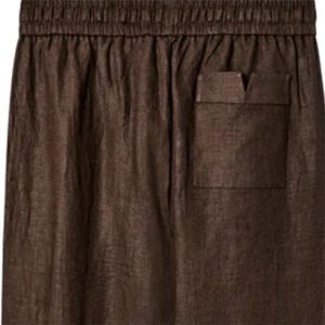 Classic Brown Linen Pants Featuring Varnished Wood <strong>Stopper</strong> <strong>Drawstrings</strong>, Versatile Design, and Breathable Fabric