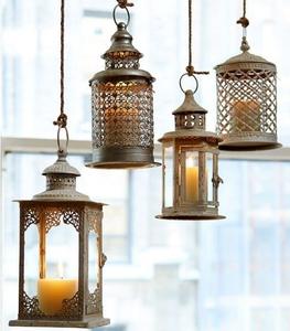 Grande lanterne en métal à cadre en fer avec panneaux de verre vintage et base robuste pour centre de table de patio ou de jardin - Product Image 5