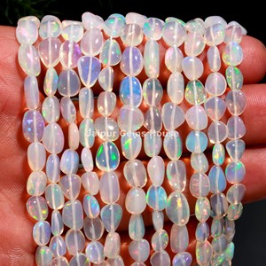 Perles de pépites d'opale éthiopienne naturelle de forme ovale lisse blanche pour la fabrication de bijoux à la mode perles de pierres précieuses - Product Image 1