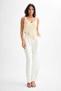 เสื้อครอปท็อปผู้หญิง คอวี แขนกุด สีเบจ ประดับลูกปัดเปลือกหอย สไตล์เซ็กซี่  ทุกขนาด - Product Image 5