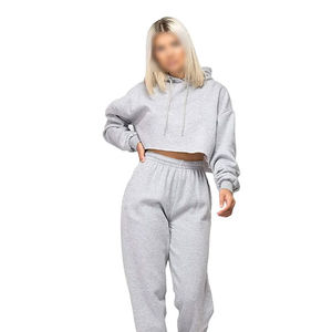 Ensembles de vêtements de sport décontractés d'hiver pour femmes, hauts courts à motif uni avec capuche, style simple, sweat-shirt et pantalon, survêtements en gros - Product Image 1