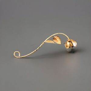Abatidor de vela chapado en oro de metal de hierro con diseño de flor hermosa - Product Image 1